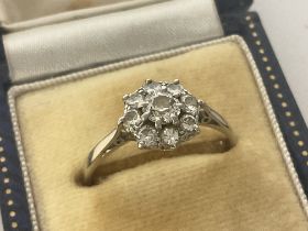 A Platinum and Diamond cluster ring, size Q. Posta