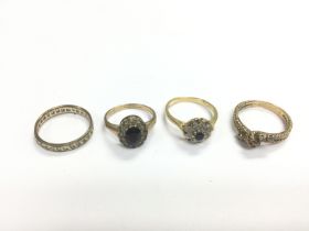 Four gold rings, one 18ct example and three 9ct, a