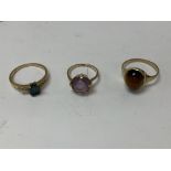 Three 9ct gold rings set with different stones inc