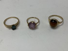 Three 9ct gold rings set with different stones inc