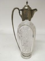 A silver and cut glass claret jug with London hall