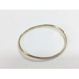A 9ct gold bangle, approx 4.7g. Shipping category