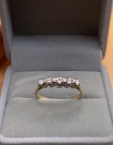 An 18ct gold 5 stone diamond ring, Size V. (A)