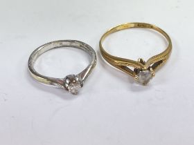 Two 9ct gold solitaire diamond rings