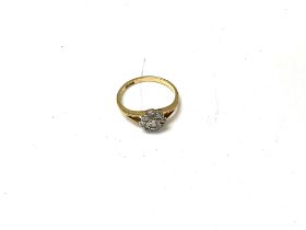 A 1920s 18ct daisy diamond cluster ring. Size L, a