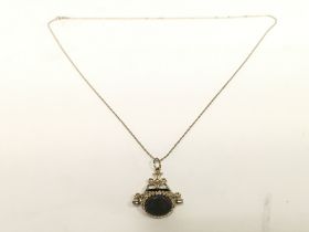 Swivel pendant on a 9ct gold chain , total weight