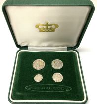 A cased 4 coin silver Maundy set, re-issued 1936.