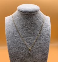 An 18ct and diamond solitare pendant and chain, ap