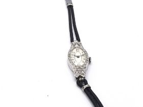 An Art Deco style ladies wrist watch. Winds and ru