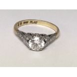 An 18carat gold and platinum ring set with a solit