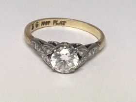 An 18carat gold and platinum ring set with a solit