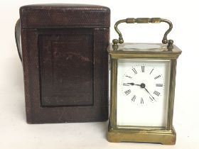 A cased French 8 Day brass Carriage clock with lev