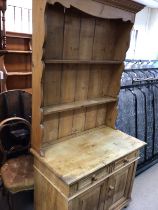 A pine dresser the raised back above two drawers a