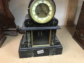 A marble slate marble mantle clock the circular di