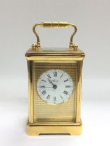 An Asprey laqcuered brass mantle clock, approx hei