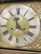 A oak eight day long case clock the brass dial wit