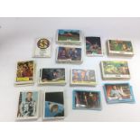 A collection of collector's cards including Captain Scarlet, Star Trek, Tarzan, Land Of The