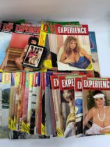 A collection of adult magazines including a card game. (D)