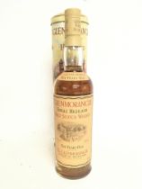 A bottle of Gelnmorangie Single Highland Malt Scot