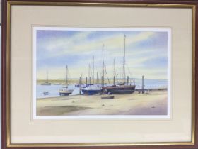 A framed and glazed watercolour of boats at Bright
