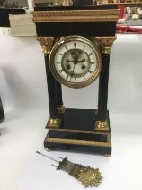 An ebonised four pillar eight day mantle clock, ap