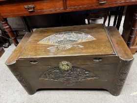 An Oriental Carved camphor chest.- NO RESERVE