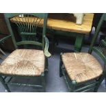 A green painted pine kitchen table with three gree