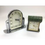 An Art Deco style chrome clock and a folding trave