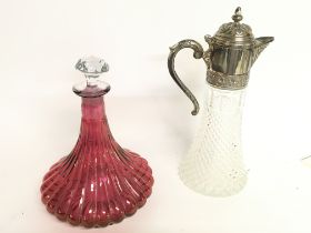 Fluted bell shaped cranberry decanter and a glass