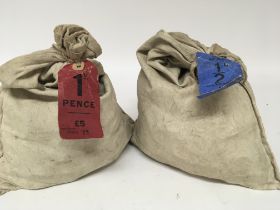 Two sealed sacks of uncirculated 1d and half pence