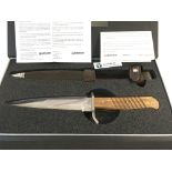 A high quality Boker knife with leather holder. bo