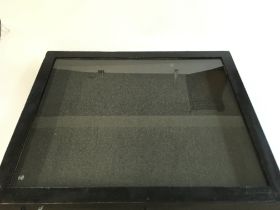 A glass topped display case. 32 x 26 x 3.5 inches.