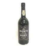 An unopened bottle of Dows 1975 Vintage Port bottl