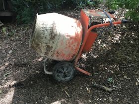 An electric free standing cement mixer.