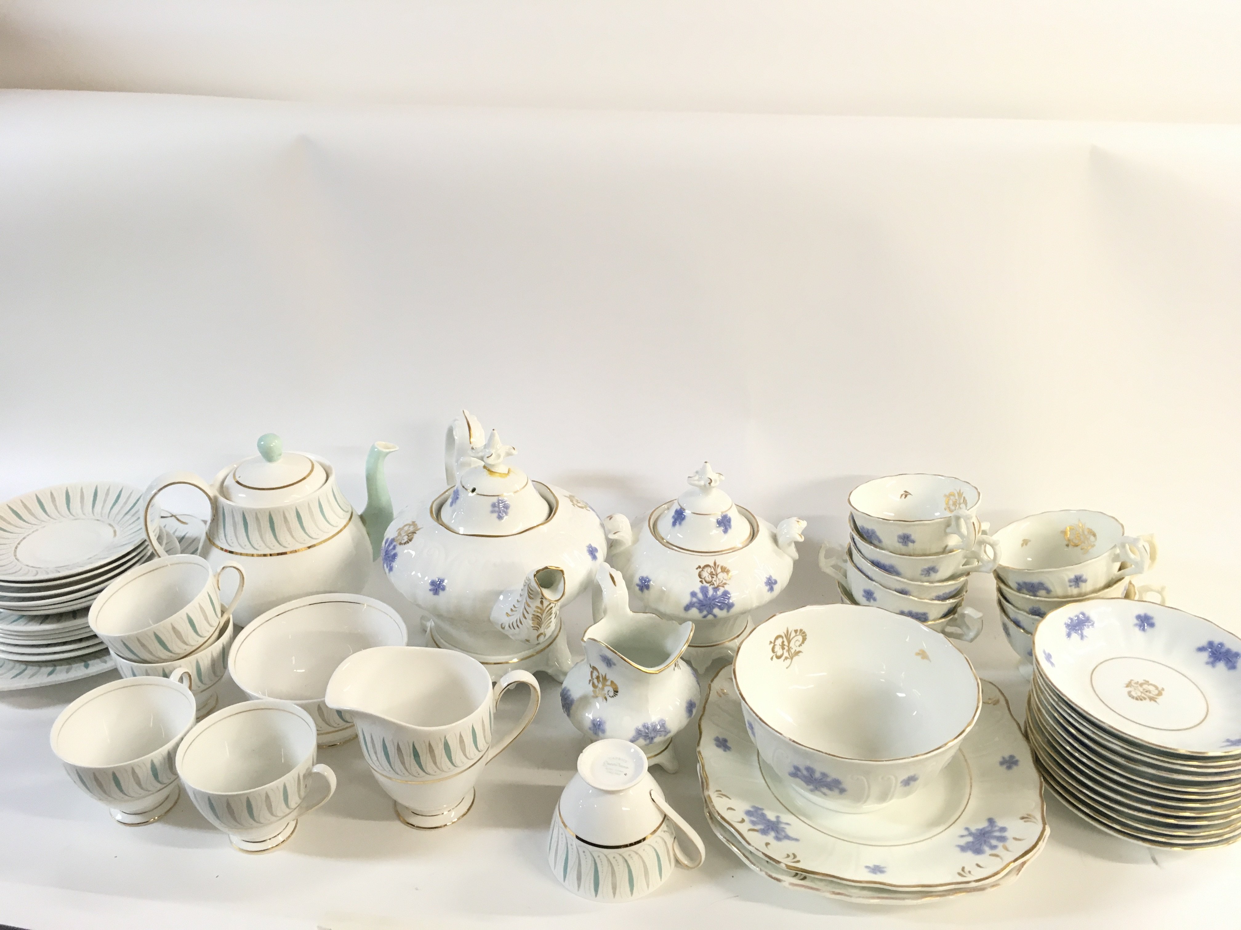 A collection of part tea sets including Queen Anne