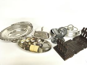 A collection of silver plate and a book slide, no