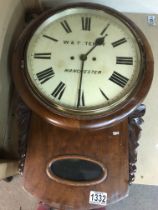 A mahogany wall clock the circular dial with Roman