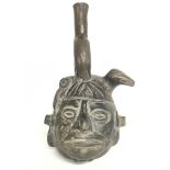 Peruvian Pottery jug in the form of a head , appro