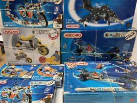 A collection of Meccano kits and accessories and l