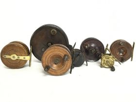 A collection of vintage Bakelite and wooden fly fi