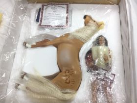 A boxed porcelain doll and horse titled 'Plea For Peace' with COA. Shipping category D.