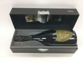 A cased bottle of Dom Perignon Vintage 2000. Shipping category D.