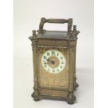 An ornate brass Mappin and Webb carriage clock ear