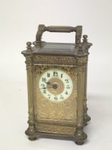 An ornate brass Mappin and Webb carriage clock ear