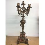 A five branch gilt candelabra raised on an onyx ba