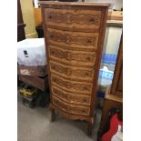 A Continental inlaid walnut flight of drawers fitt