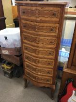 A Continental inlaid walnut flight of drawers fitt