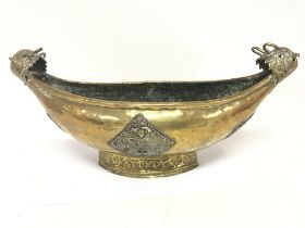 A late 19th century brass Scandinavian dish with a