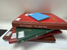 5 albums of World postage stamps. (D)