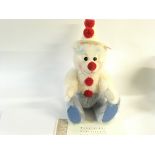 A Steiff teddy bear clown in box with certificate.